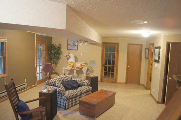 Family room downstairs with French doors at Caro Drive